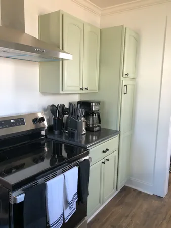 a kitchen with a sink and cabinets
