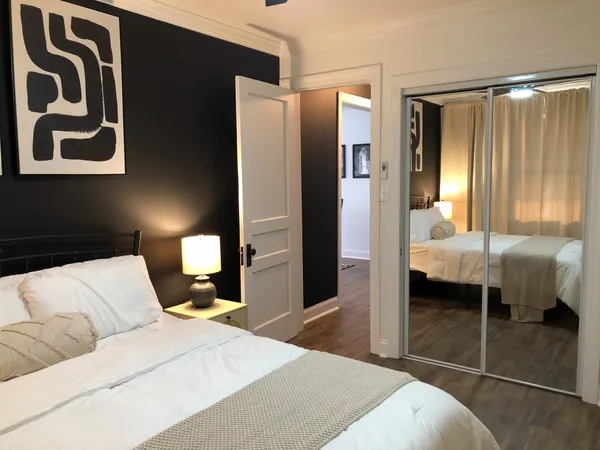 a bedroom with a bed and a walk in closet