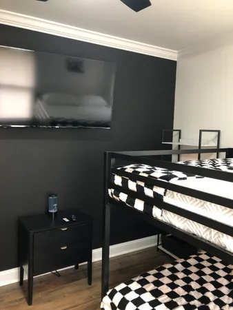 a room with glass top table and chairs