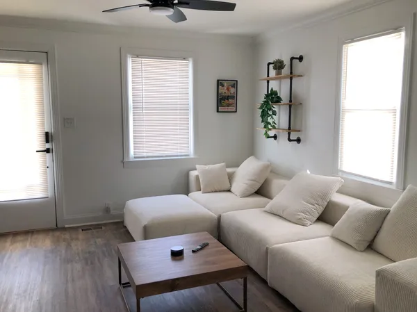 a living room with a couch and a window