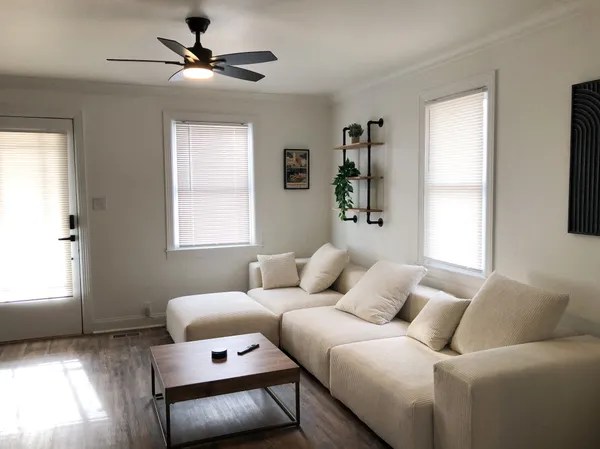 a living room with furniture and a window