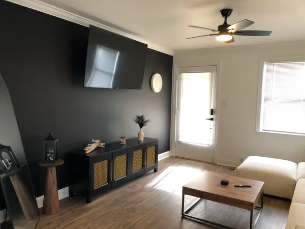 a living room with furniture and a window