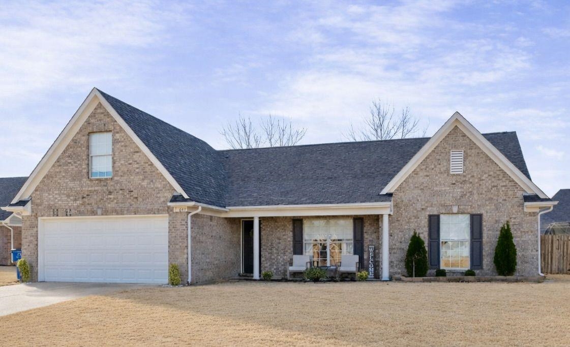 6411 Sandbourne West Olive Branch, MS 38654 - Photo 12 of 22 a front view of a house with a garden