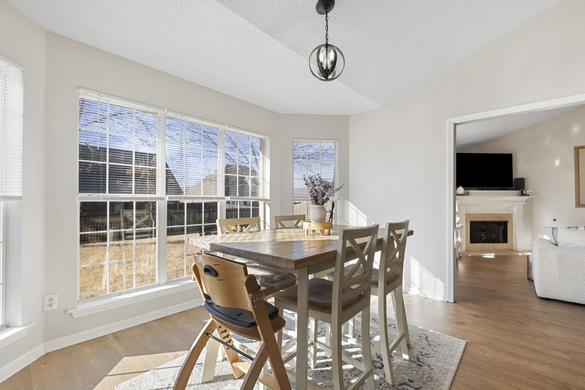 6411 Sandbourne West Olive Branch, MS 38654 - Photo 20 of 22 a view of a dining room with furniture window and wooden floor