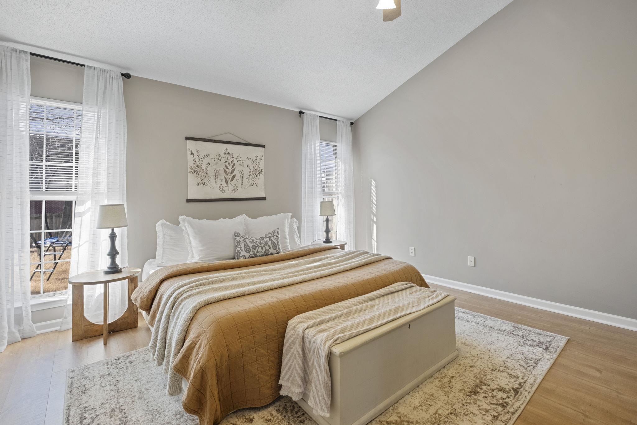 6411 Sandbourne West Olive Branch, MS 38654 - Photo 2 of 22 a bed sitting in a bedroom next to a window