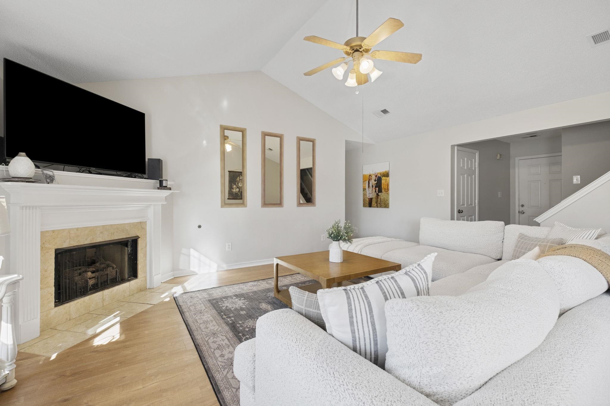 6411 Sandbourne West Olive Branch, MS 38654 - Photo 21 of 22 a living room with furniture a flat screen tv and a fireplace