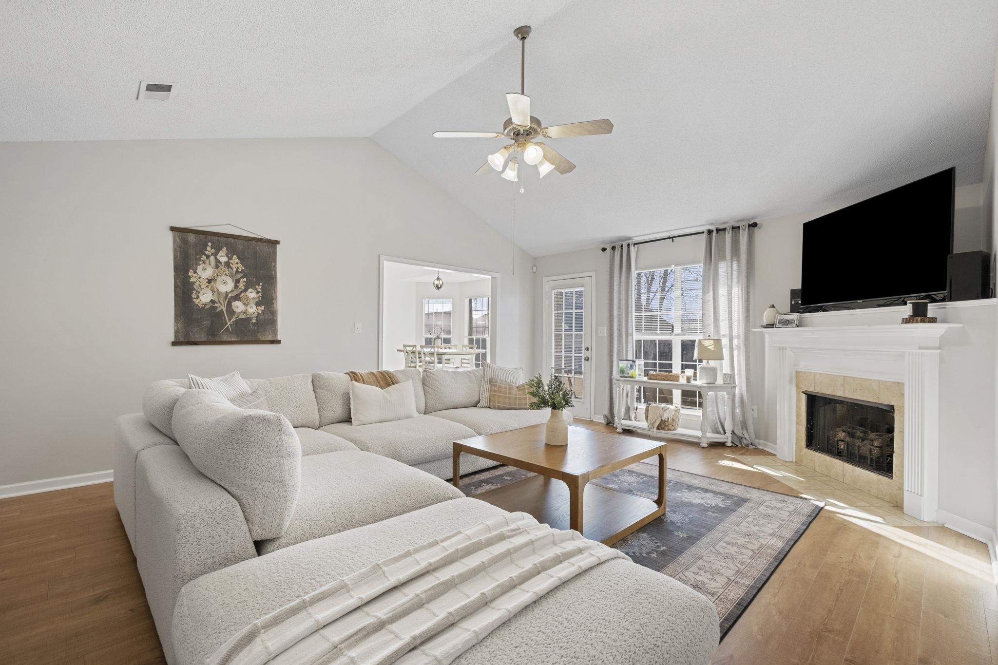6411 Sandbourne West Olive Branch, MS 38654 - Photo 22 of 22 a living room with furniture a fireplace and a flat screen tv