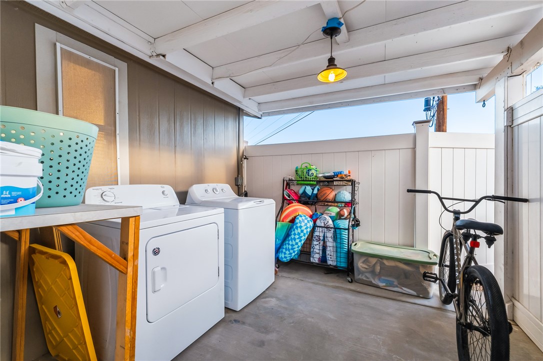 1996 Ramar Road Bullhead City, AZ 86442 - Photo 31 of 65 This covered outdoor space features a washer and dryer, providing functional utility