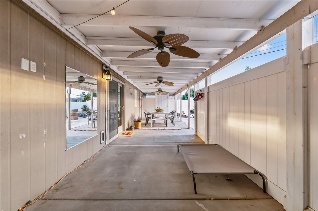 1996 Ramar Road Bullhead City, AZ 86442 - Photo 34 of 65 Covered patio area featuring overhead fans, string lighting, and a concrete floor