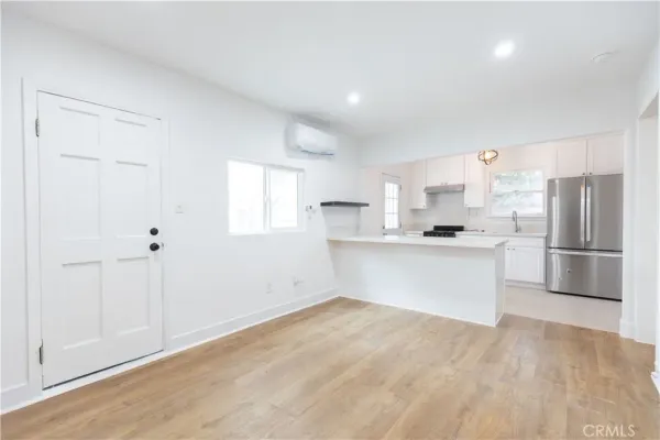 a view of kitchen with wooden floor