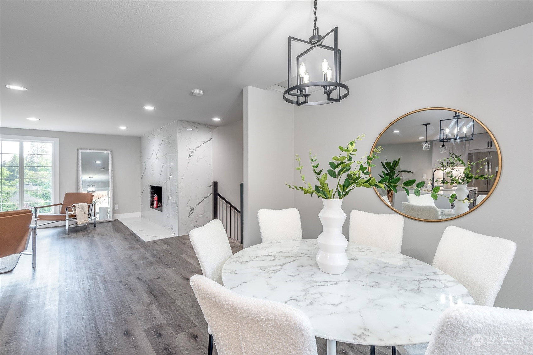 1582 Rainier Drive Fircrest, WA 98466 - Photo 18 of 40 a view of a dining room with furniture a chandelier and wooden floor