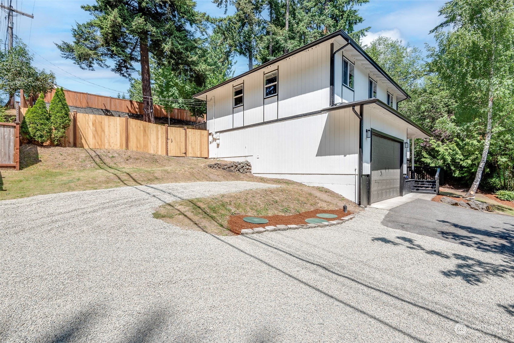 1582 Rainier Drive Fircrest, WA 98466 - Photo 2 of 40 a view of a house with a yard and garage