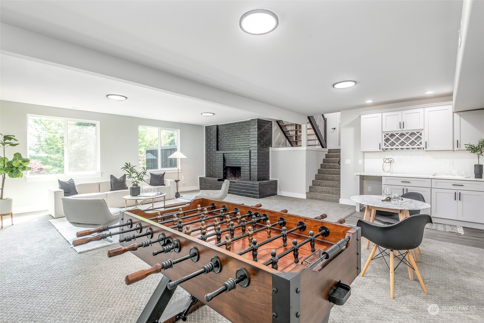 1582 Rainier Drive Fircrest, WA 98466 - Photo 22 of 40 a living room with stainless steel appliances furniture a rug and a large window