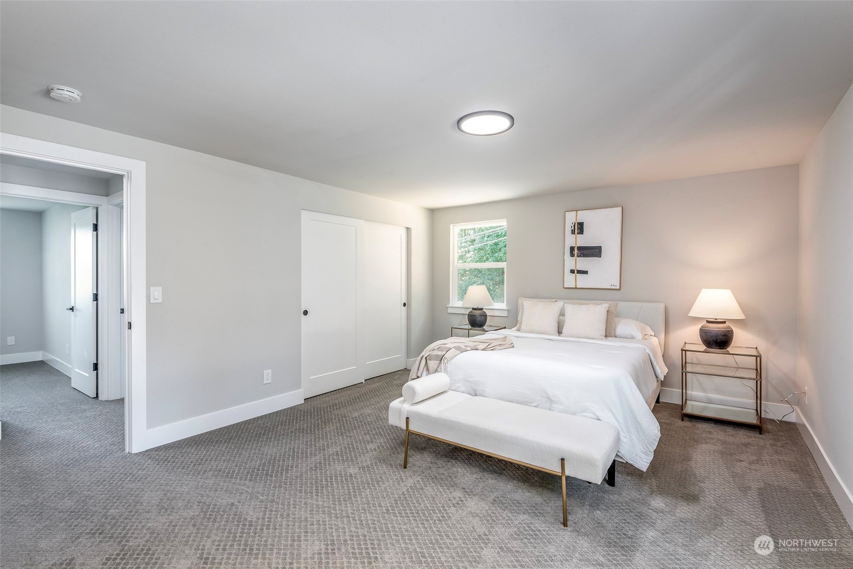 1582 Rainier Drive Fircrest, WA 98466 - Photo 25 of 40 a bedroom with a bed and white walls