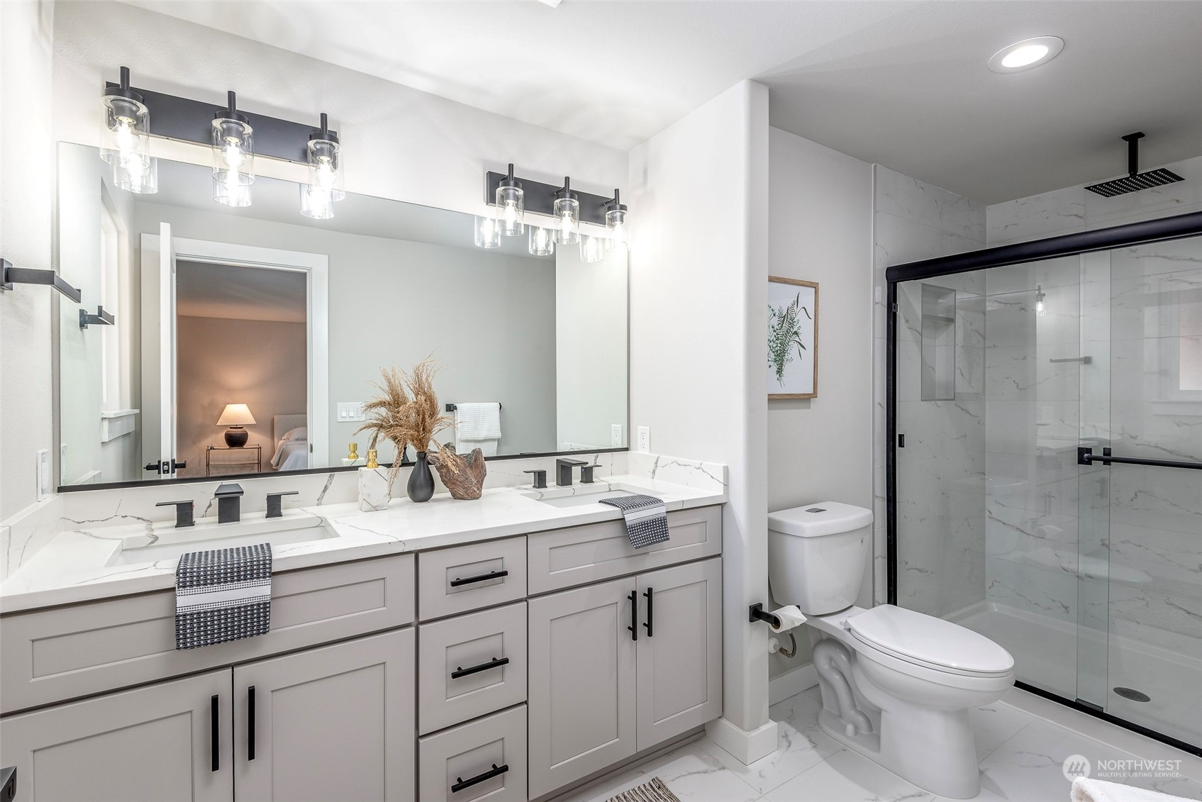 1582 Rainier Drive Fircrest, WA 98466 - Photo 28 of 40 a bathroom with a double vanity sink toilet mirror and shower