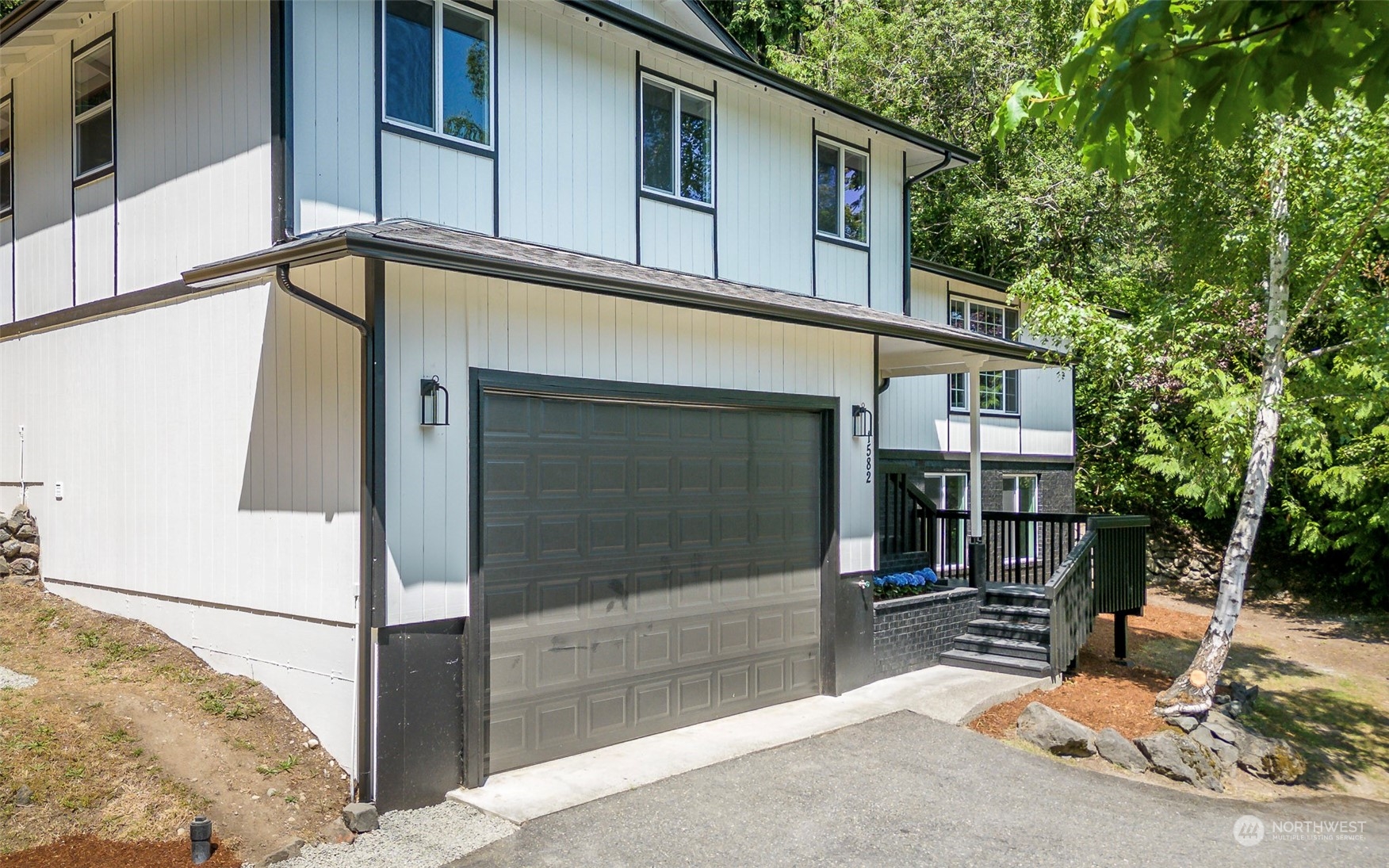 1582 Rainier Drive Fircrest, WA 98466 - Photo 3 of 40 a view of a house with backyard and sitting area