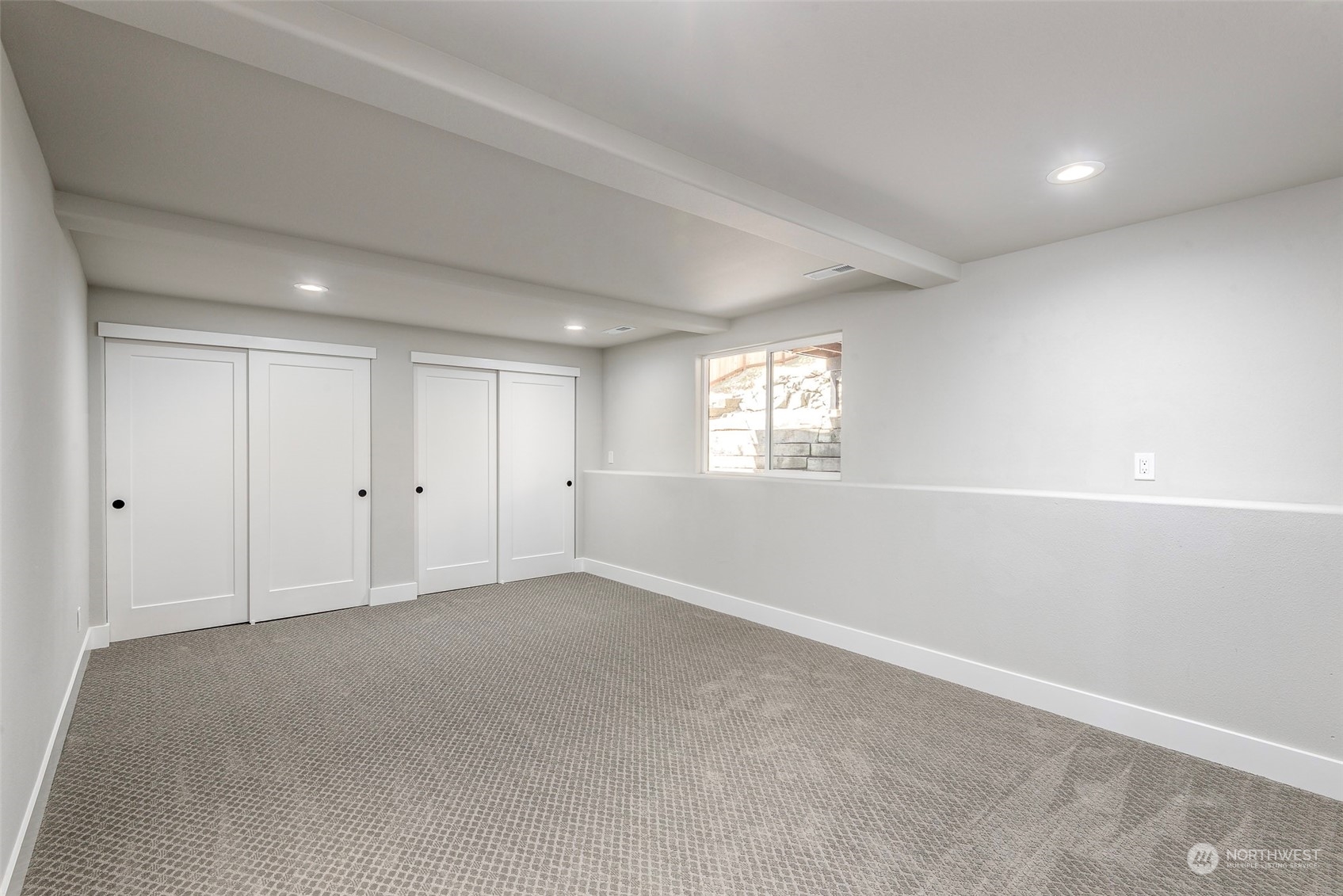 1582 Rainier Drive Fircrest, WA 98466 - Photo 31 of 40 a view of an empty room with a window