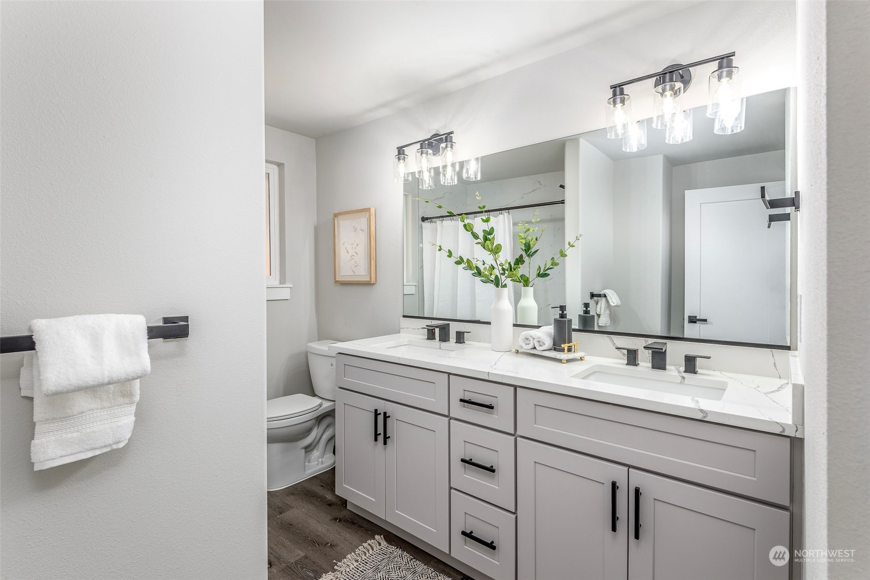1582 Rainier Drive Fircrest, WA 98466 - Photo 32 of 40 a bathroom with a double vanity sink and a mirror