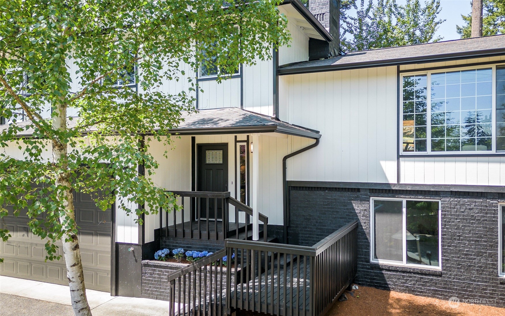 1582 Rainier Drive Fircrest, WA 98466 - Photo 5 of 40 a front view of house with deck and outdoor seating