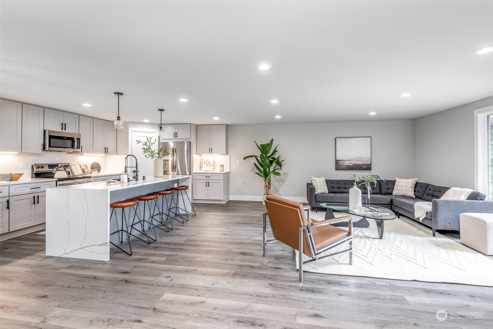 1582 Rainier Drive Fircrest, WA 98466 - Photo 10 of 40 a living room with furniture and a kitchen view