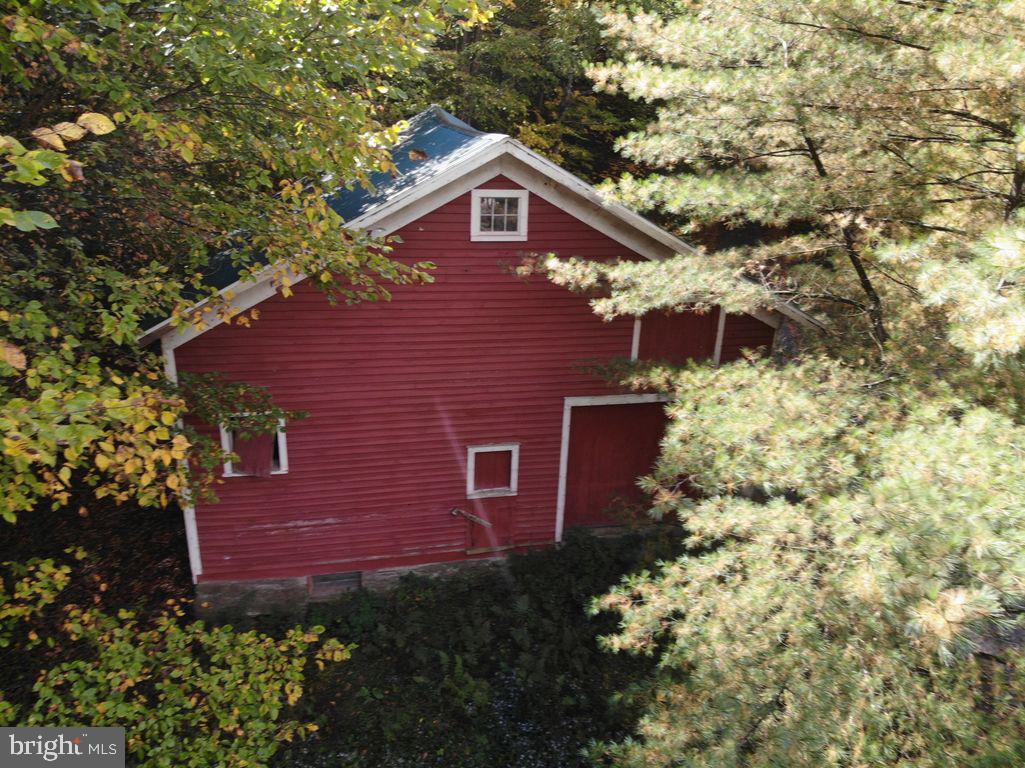 45 Grocery Hill Road Equinunk, PA 18417 - Photo 4 of 24 a view of a brick house with a yard