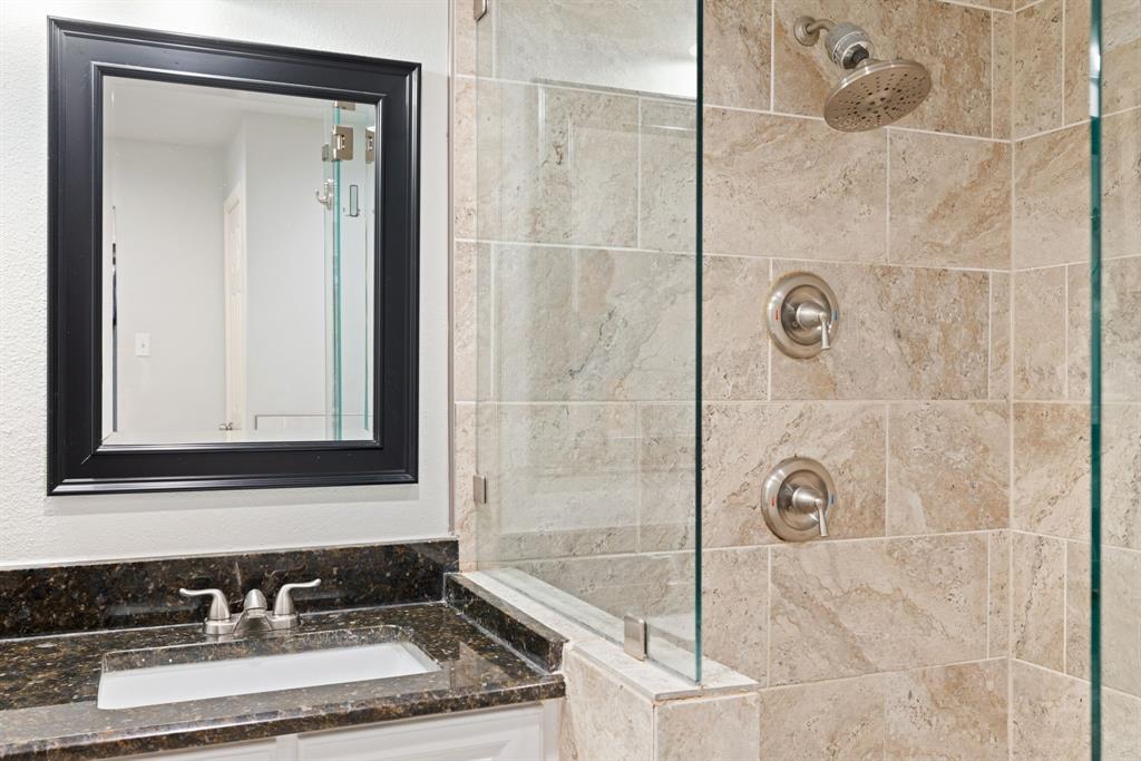 15935 Longvista Drive Dallas, TX 75248 - Photo 18 of 27 a bathroom with a sink and a mirror