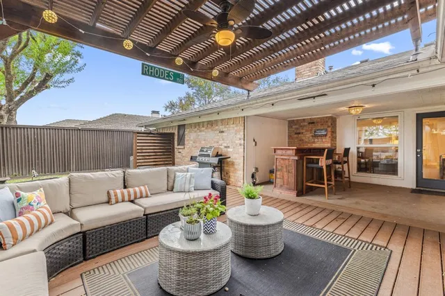 a view of a patio with couches and potted plants