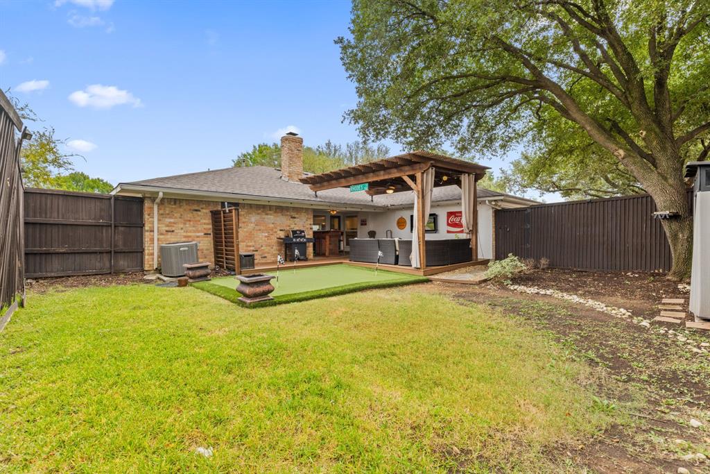 15935 Longvista Drive Dallas, TX 75248 - Photo 26 of 27 a front view of a house with a yard
