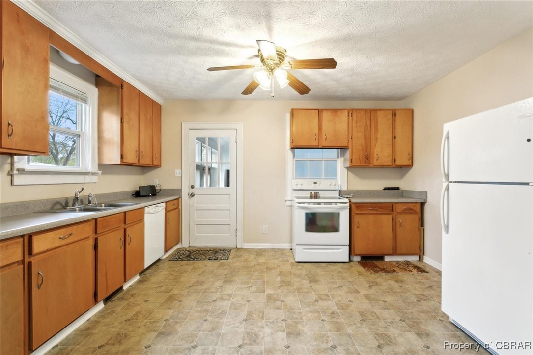 345 Fox Hill Road Hampton, VA 23669 - Photo 14 of 46 Kitchen with white appliances, light countertops, a sink, and ceiling fan