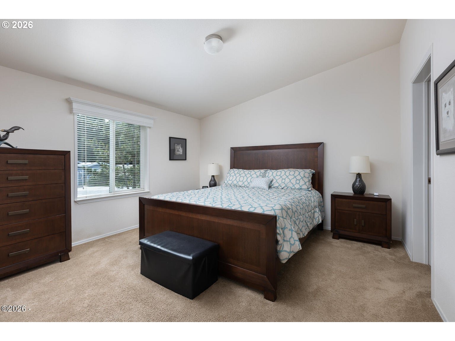 777 Southeast Winchell Street Depoe Bay, OR 97341 - Photo 11 of 29 a bed sitting in a bedroom next to a window
