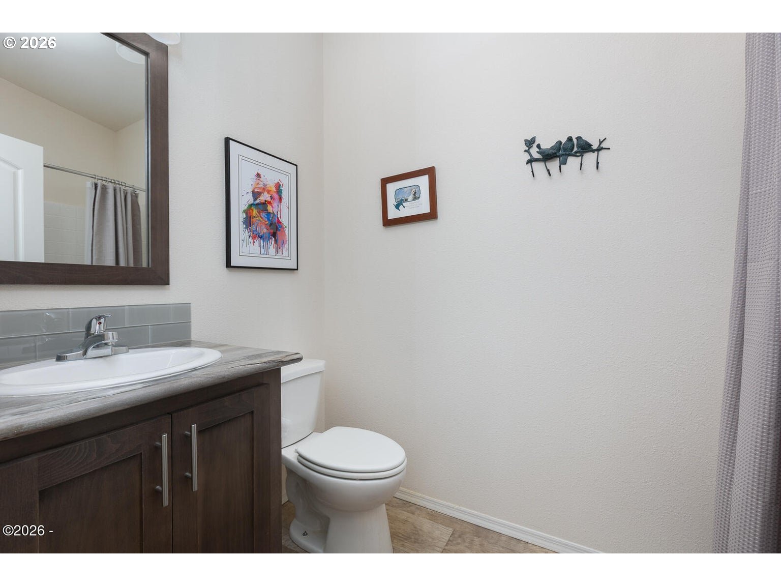 777 Southeast Winchell Street Depoe Bay, OR 97341 - Photo 17 of 29 a bathroom with a toilet a sink and mirror