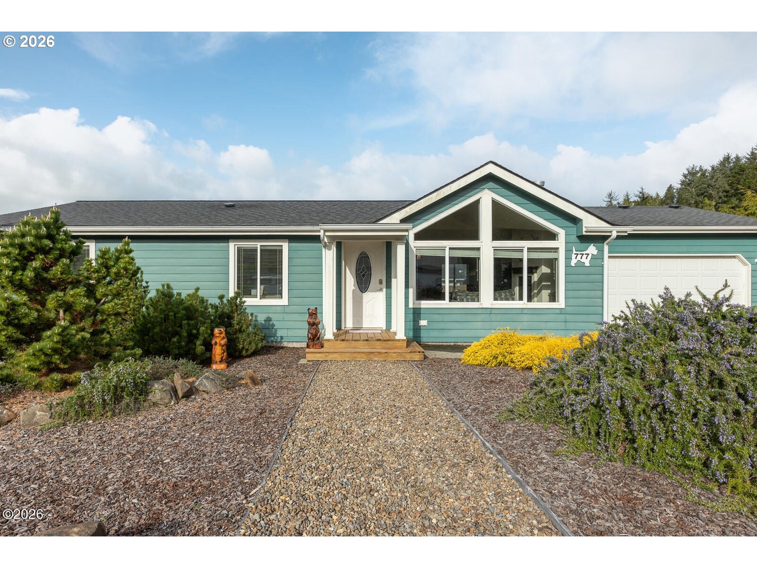 777 Southeast Winchell Street Depoe Bay, OR 97341 - Photo 2 of 29 a front view of a house with a yard