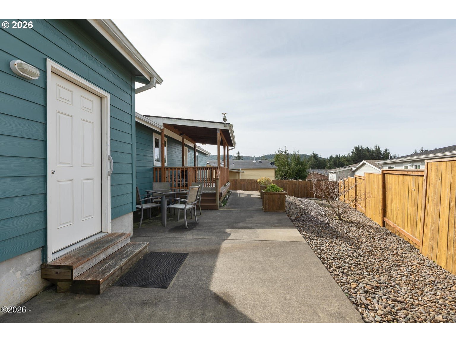777 Southeast Winchell Street Depoe Bay, OR 97341 - Photo 21 of 29 a view of a backyard with sitting area
