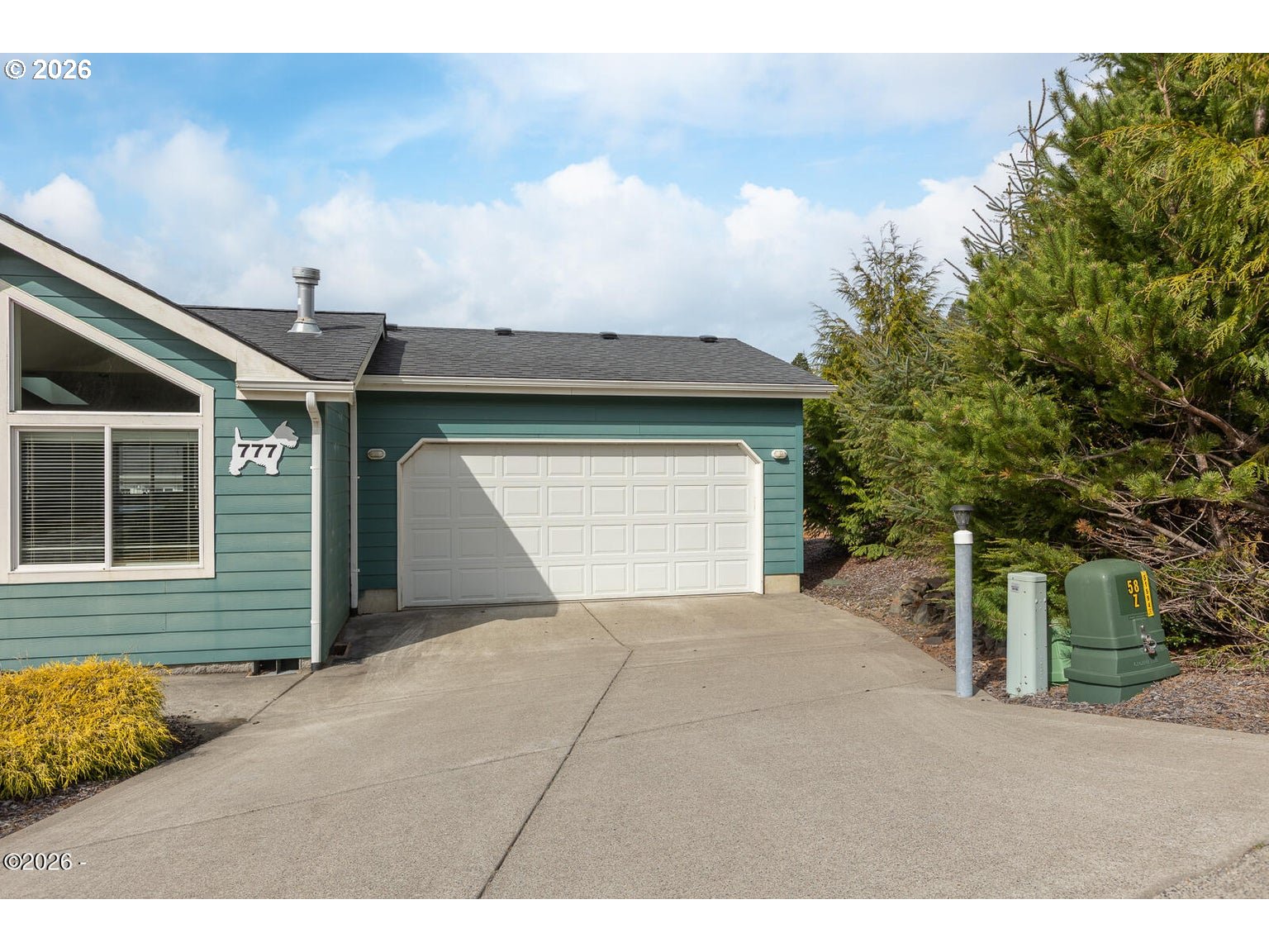 777 Southeast Winchell Street Depoe Bay, OR 97341 - Photo 22 of 29 a front view of a house with a garage