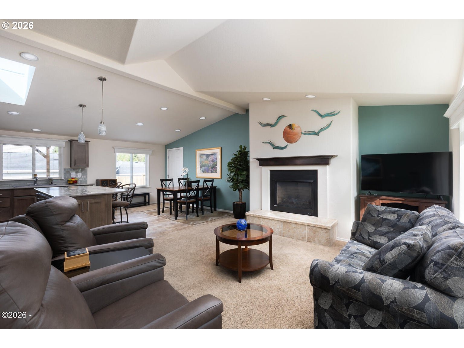 777 Southeast Winchell Street Depoe Bay, OR 97341 - Photo 3 of 29 a living room with furniture and a fireplace