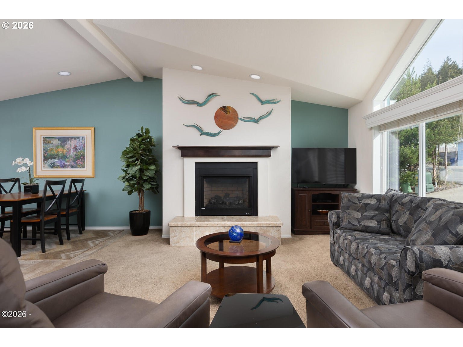 777 Southeast Winchell Street Depoe Bay, OR 97341 - Photo 4 of 29 a living room with furniture and a fireplace