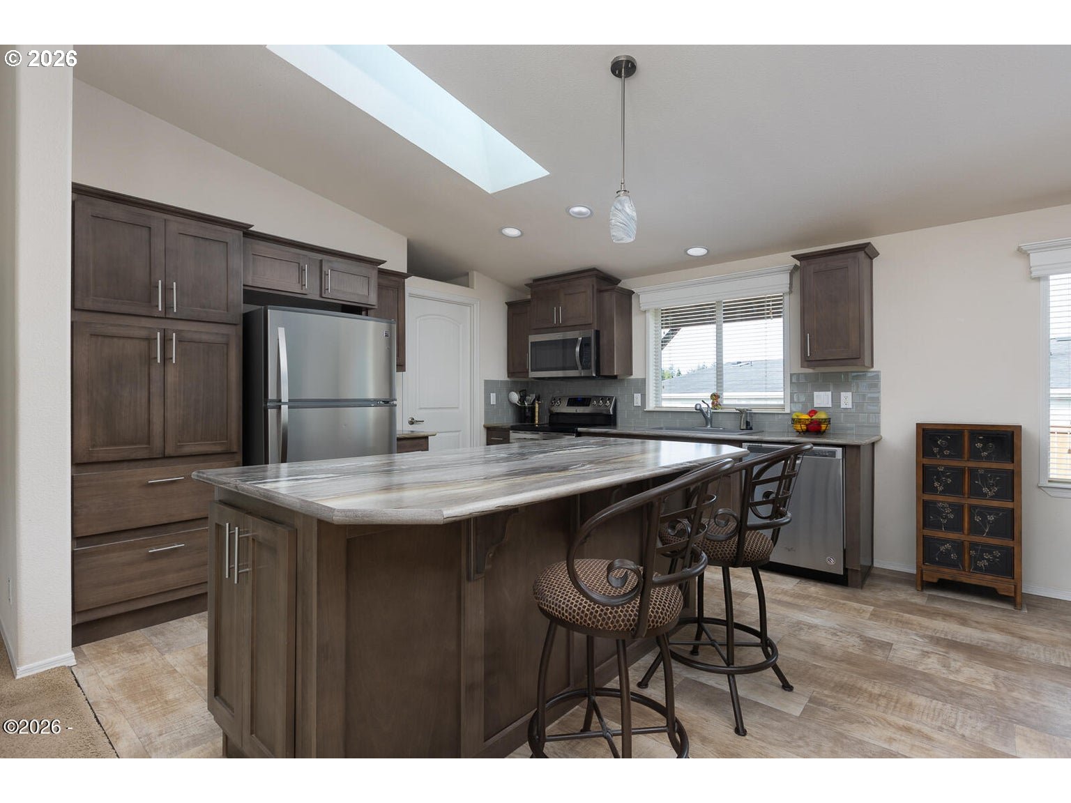 777 Southeast Winchell Street Depoe Bay, OR 97341 - Photo 6 of 29 a kitchen with kitchen island a sink stove and refrigerator