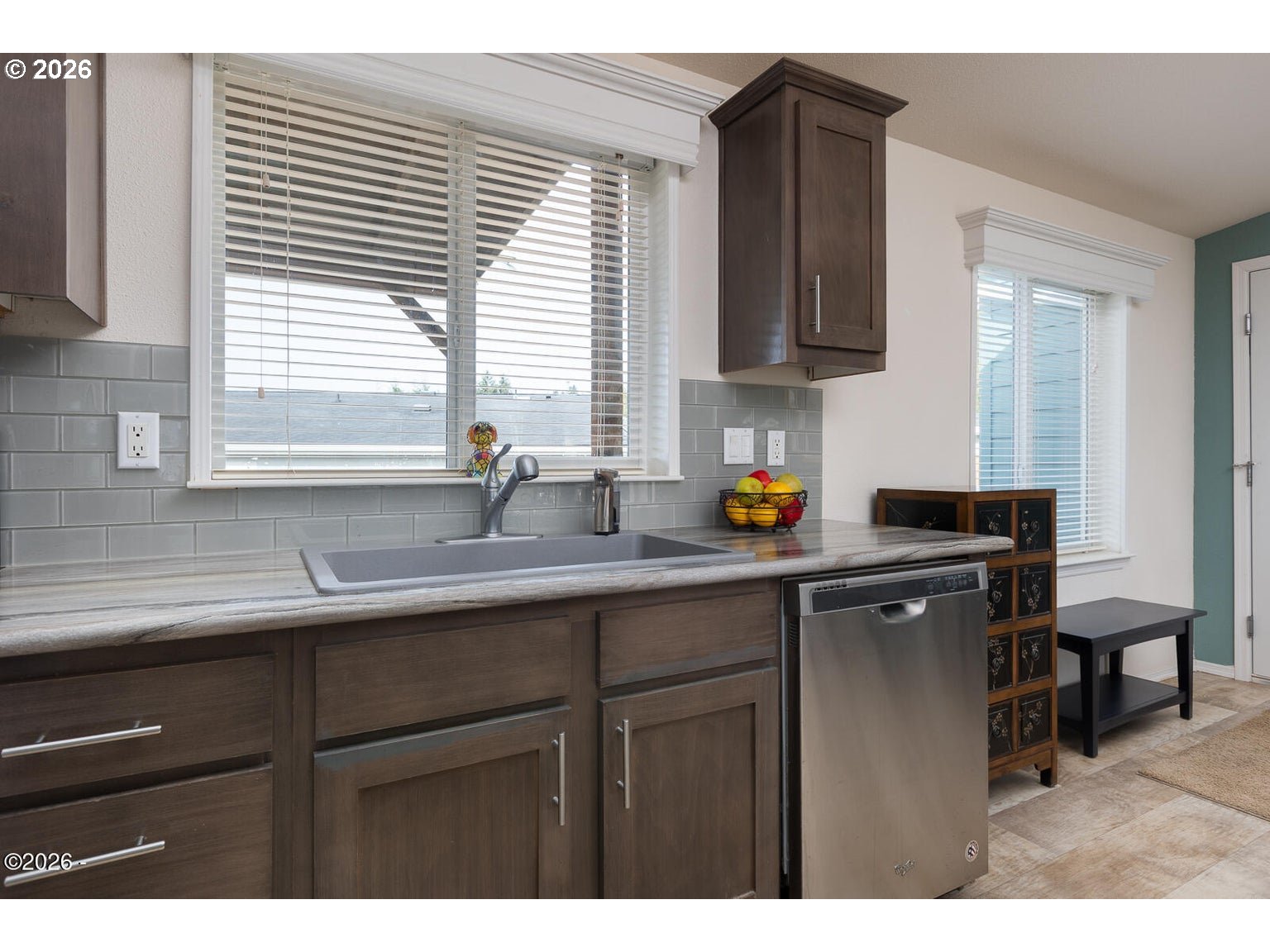 777 Southeast Winchell Street Depoe Bay, OR 97341 - Photo 9 of 29 a kitchen with stainless steel appliances a sink stove and cabinets