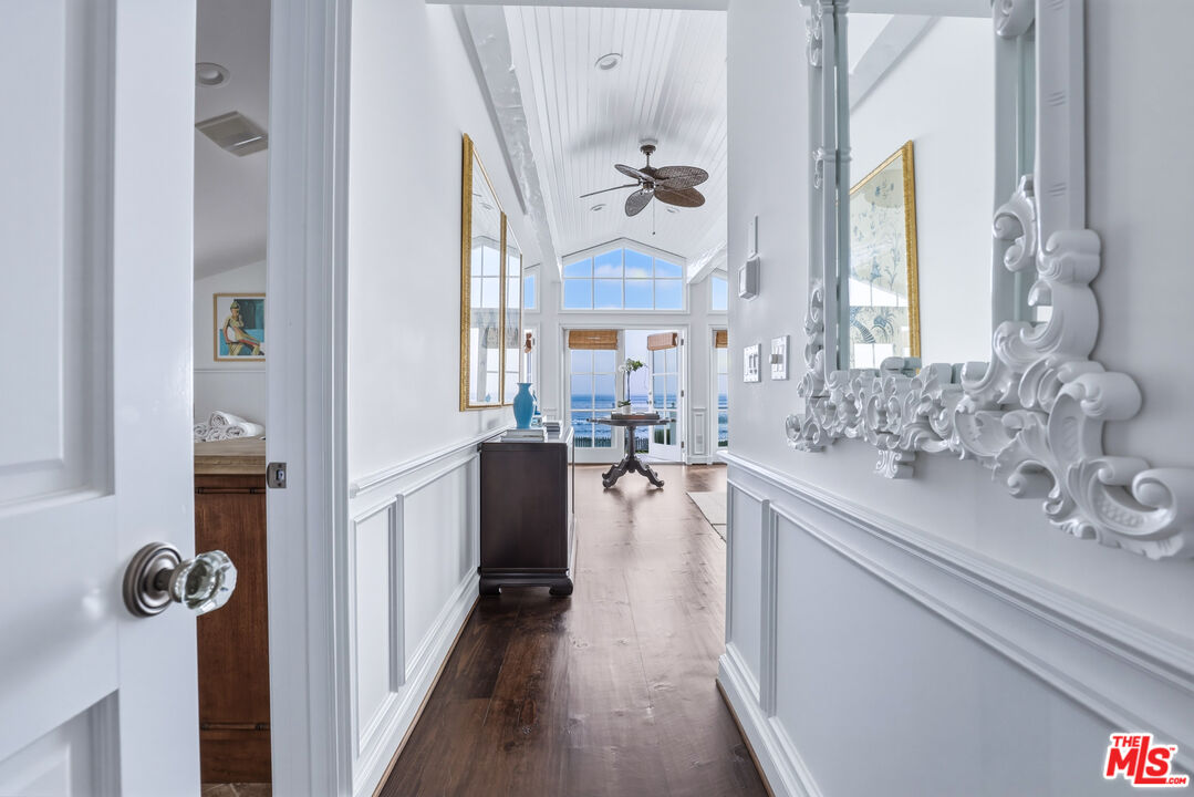 30810 Broad Beach Road Malibu, CA 90265 - Photo 30 of 55 a en suite bathroom with a sink a mirror a bathtub and window