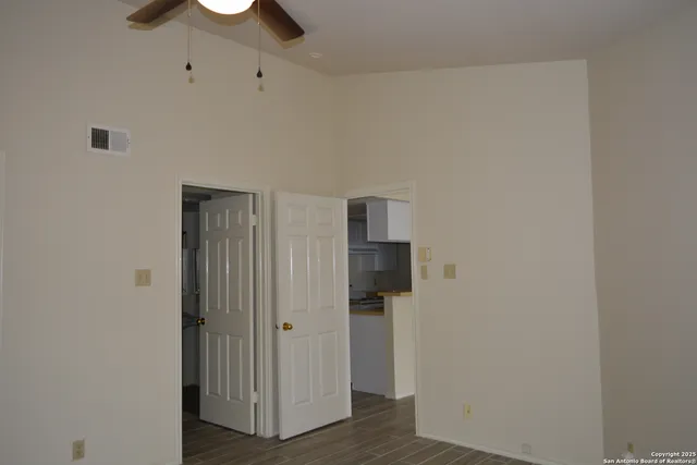 a view of hallway with wooden floor