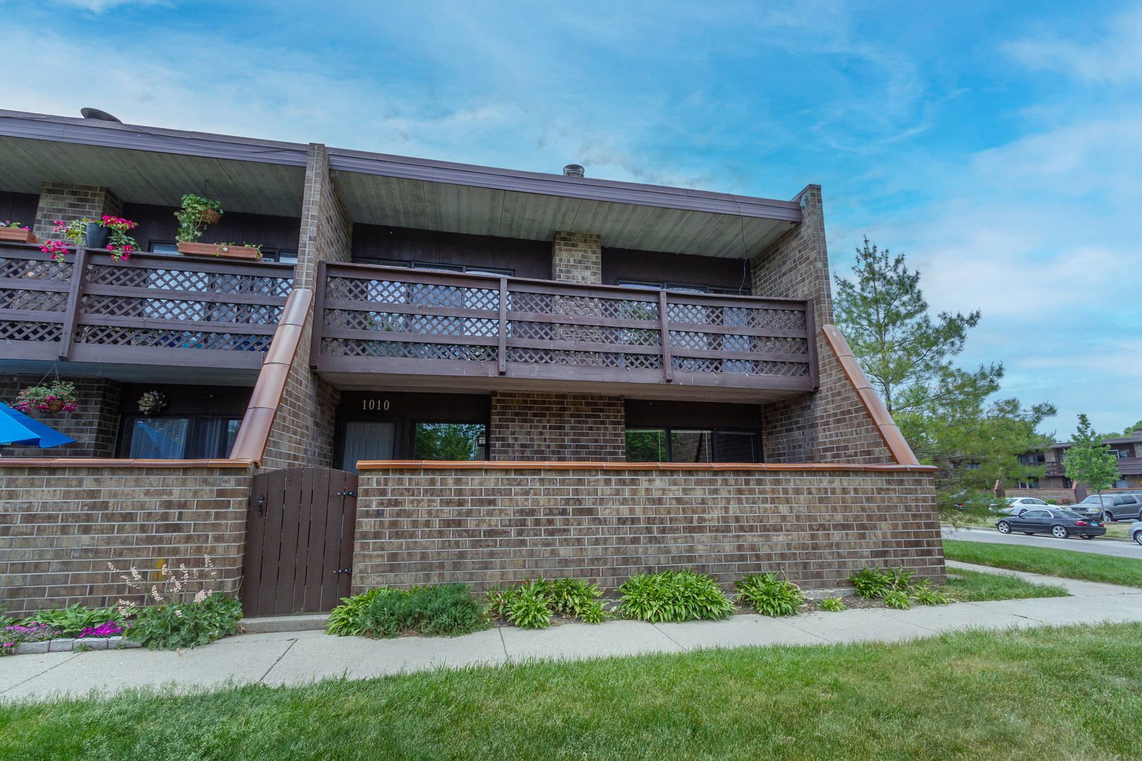 1010 Kenneth Circle Elgin, IL 60120 - Photo 1 of 18 a front view of a house with a yard
