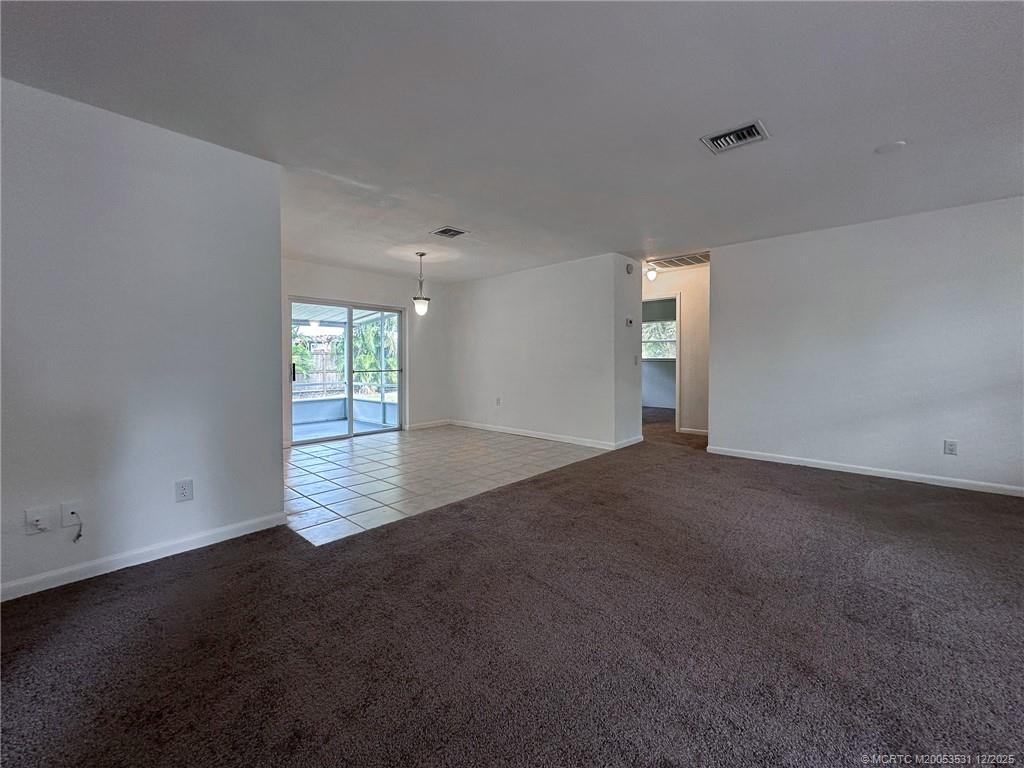 1739 Southeast Madison Street Stuart, FL 34997 - Photo 11 of 38 an empty room with windows