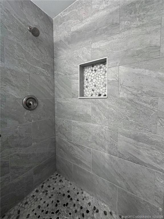 1739 Southeast Madison Street Stuart, FL 34997 - Photo 23 of 38 a bathroom with a shower and a sink