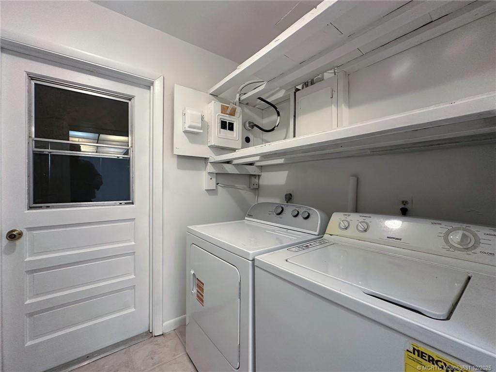 1739 Southeast Madison Street Stuart, FL 34997 - Photo 27 of 38 a utility room with dryer and washer
