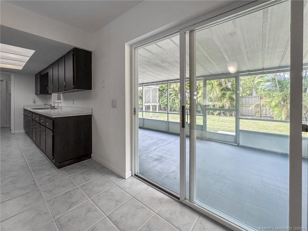 1739 Southeast Madison Street Stuart, FL 34997 - Photo 29 of 38 a view of a kitchen with a sink and windows