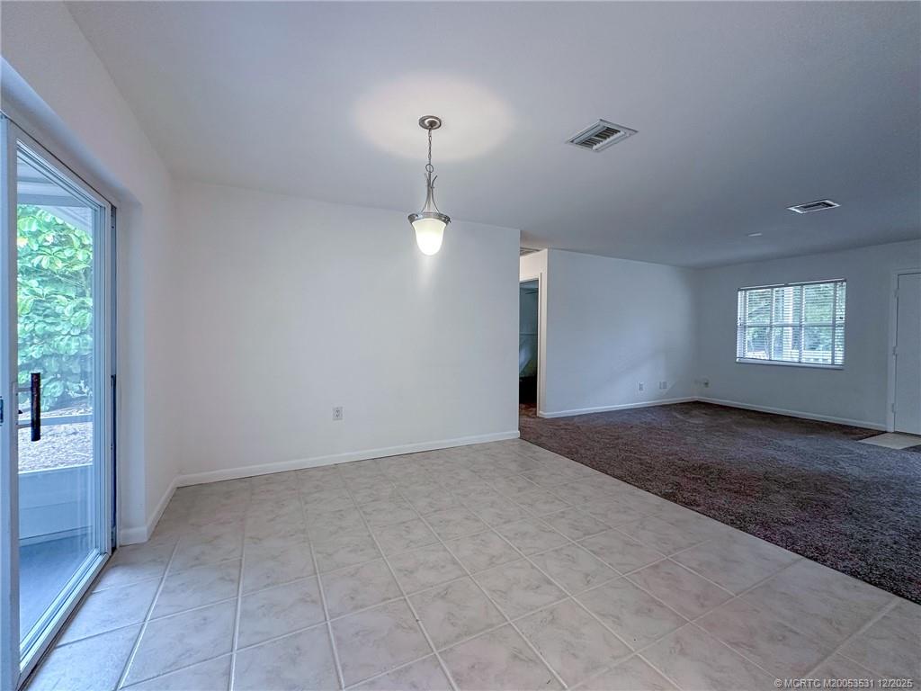 1739 Southeast Madison Street Stuart, FL 34997 - Photo 30 of 38 a view of an empty room and window