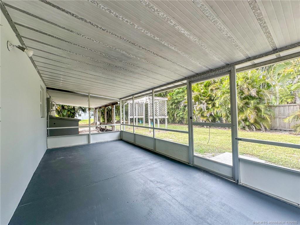 1739 Southeast Madison Street Stuart, FL 34997 - Photo 31 of 38 a view of an empty room with large windows