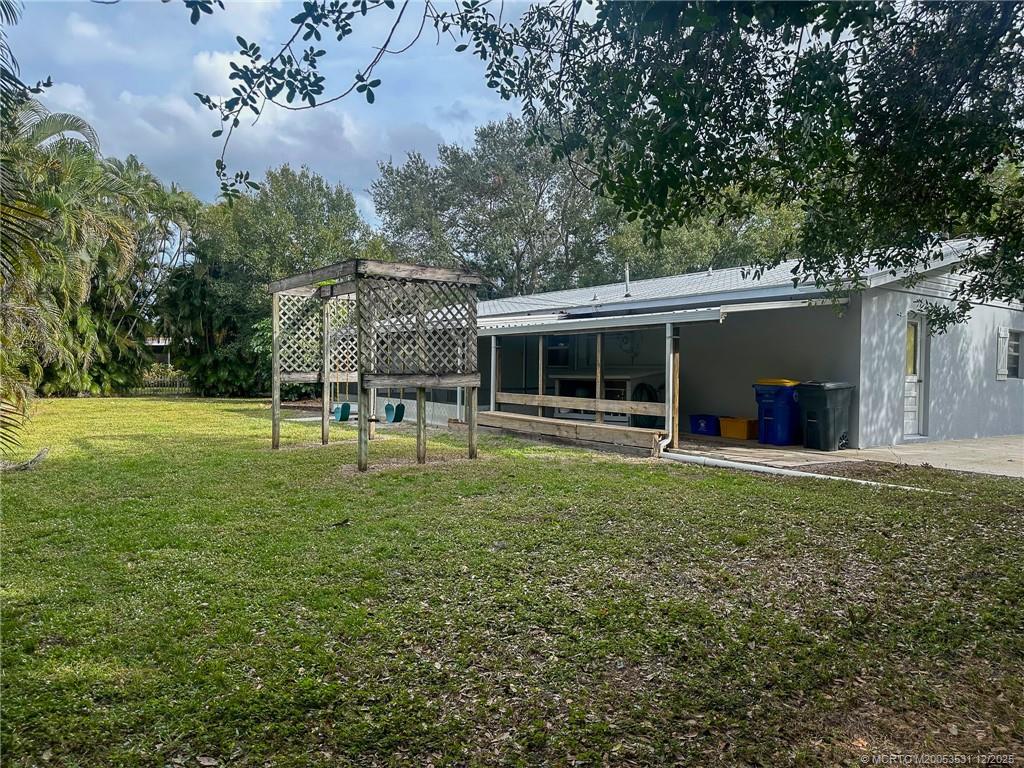 1739 Southeast Madison Street Stuart, FL 34997 - Photo 35 of 38 a view of a house with a backyard