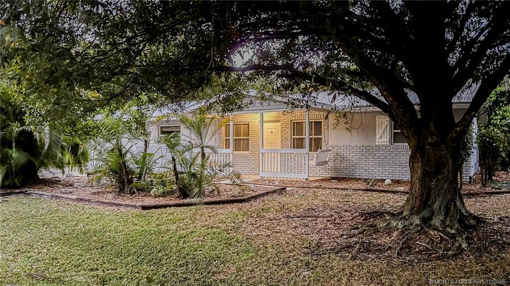 1739 Southeast Madison Street Stuart, FL 34997 - Photo 5 of 38 a view of a house with a tree in the yard