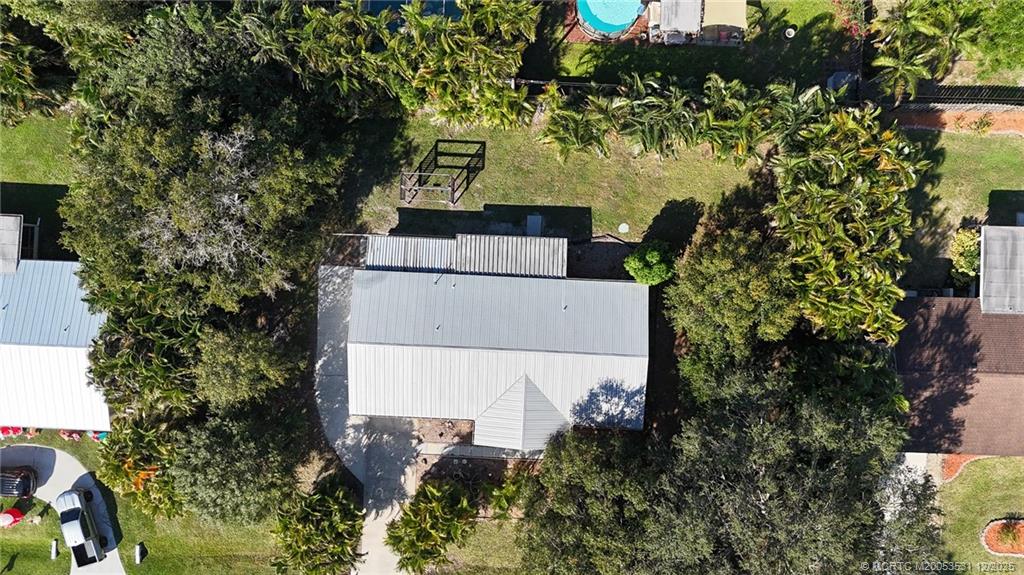 1739 Southeast Madison Street Stuart, FL 34997 - Photo 6 of 38 an aerial view of a house with a yard